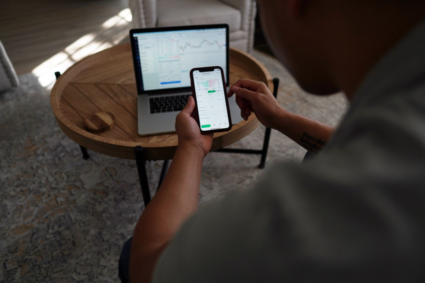 Black man reviewing investment portfolio and brokerage account online