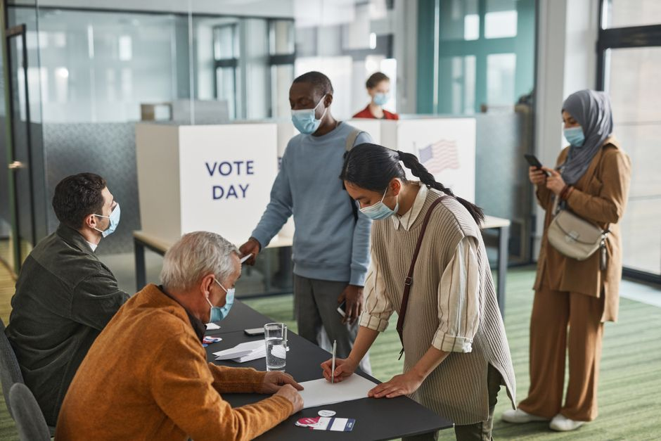 Community members voting — photo via Pexels