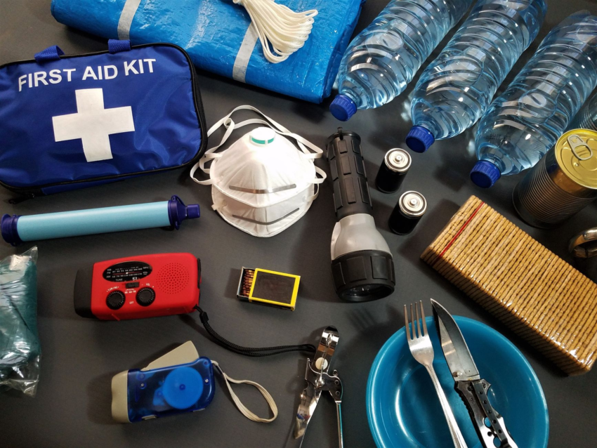 A packed emergency preparedness kit — water, first aid, and essential supplies