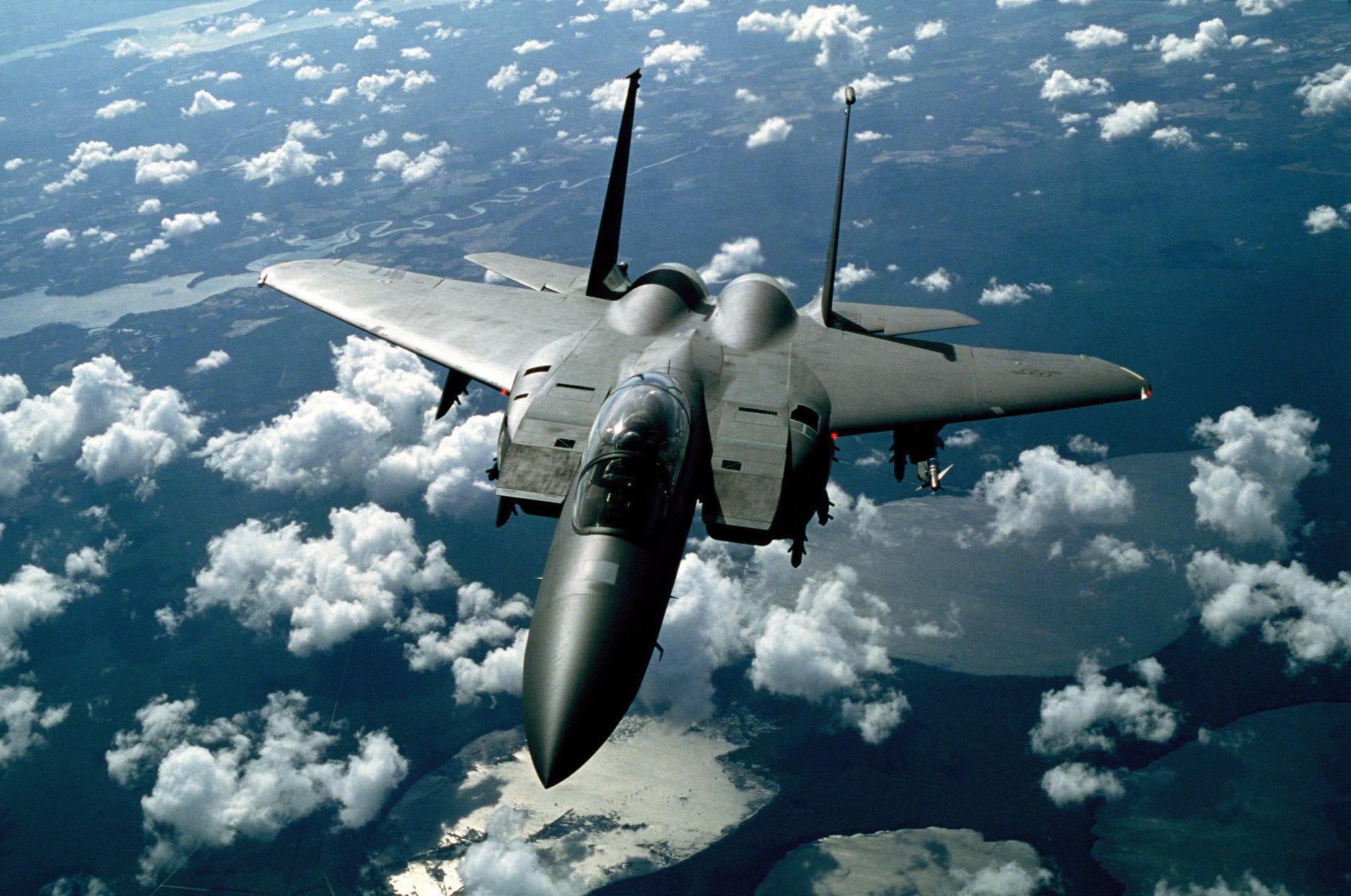 Air defense systems intercepting incoming missiles over a Gulf city, illustrative image