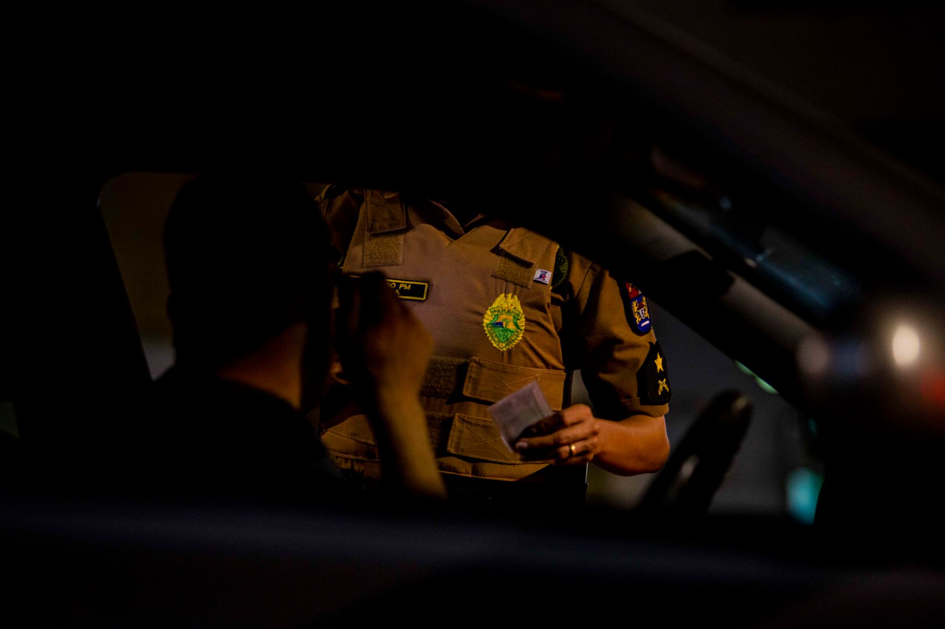 A vehicle pulled over on a highway at night, illustrative image