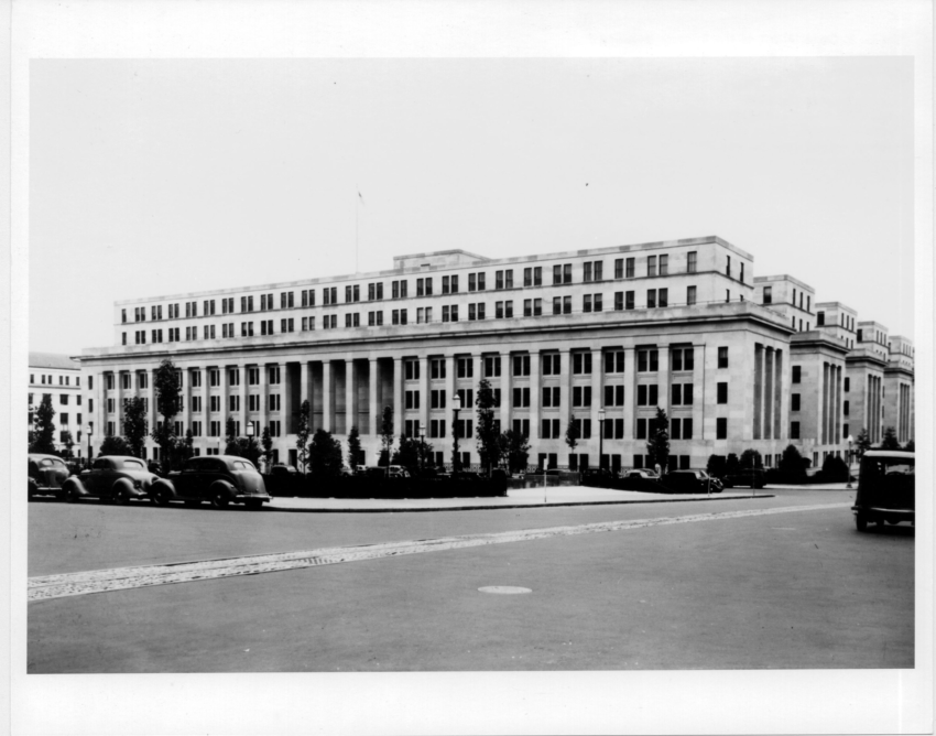 Archival photograph of the Main Interior Building, approximately 1950, provided by USGS. Institutional context for the Interior Department story.