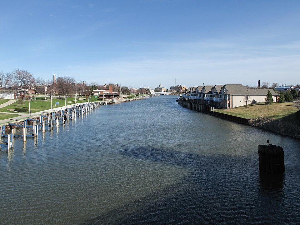 Street-level photo: The Black River as viewed downstream from the east side of a bridge on 10th Street in Port Huron, Michigan.