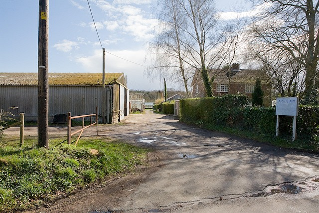 Street-level photo: Entrance to Abbotts Farm, Canada Road This farm is a former horticultural nursery with many large glass houses which are mostly now disused. The owner, Colin, was kind enough to show me round. He explained that this kind of business had been killed off by a switch to sourcing plants and cut flowers from abroad. Some glass houses were still in use by tenants but it was hard to obtain planning permission either to demolish them or for viable alternative business use. There is a large disused boiler house on the site.