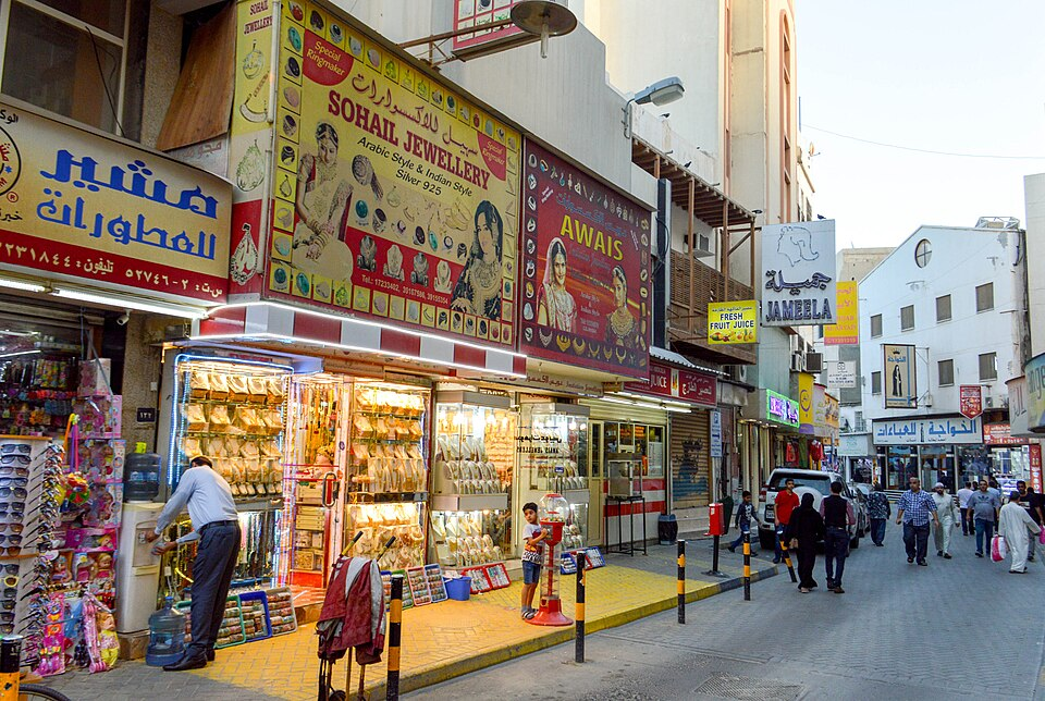 Street-level photo: 500px provided description: Market Street [#city ,#people ,#street ,#market ,#sign ,#shops ,#Bahrain ,#Manama]